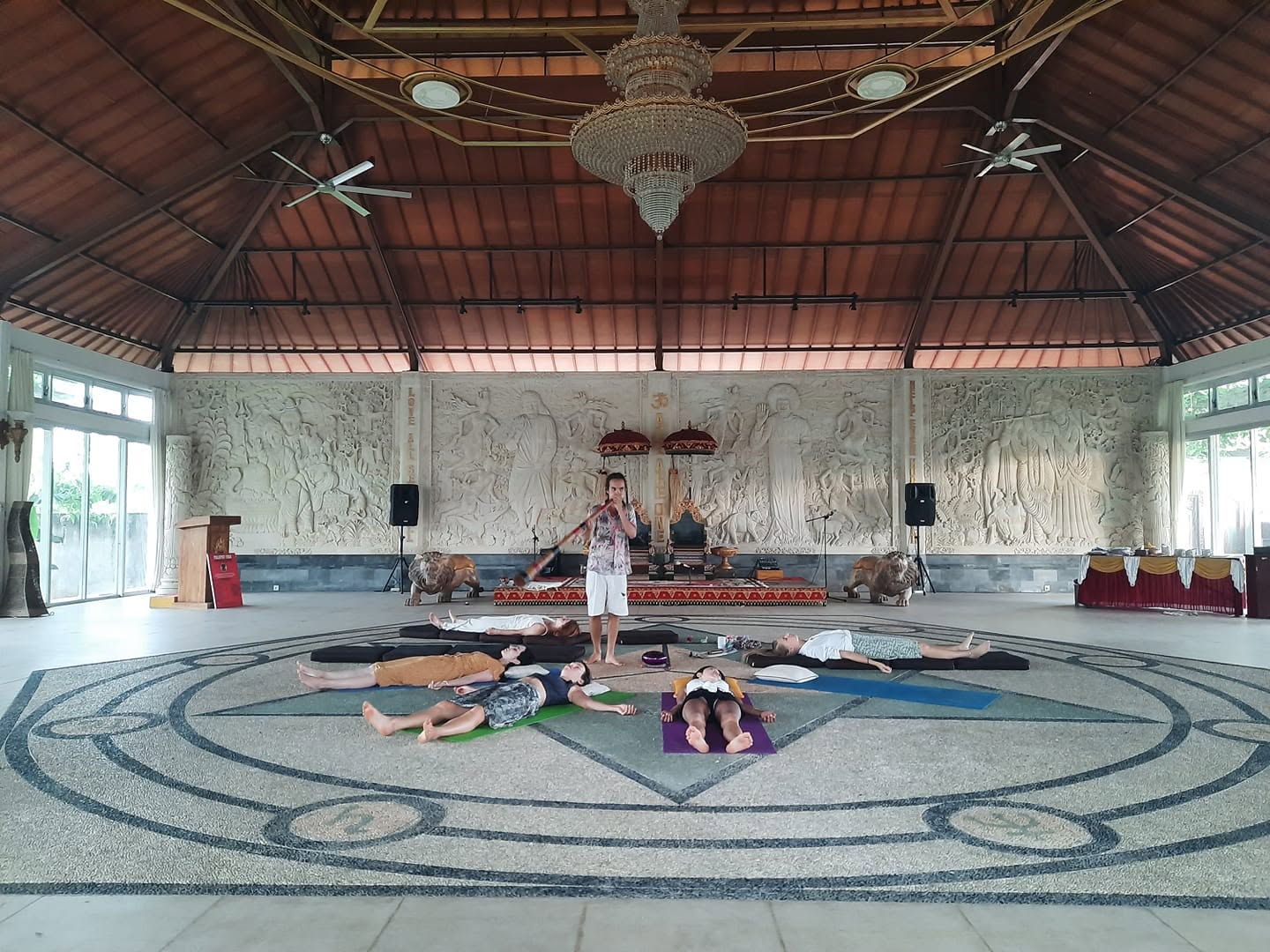 Session in a grand carved hall in Bali