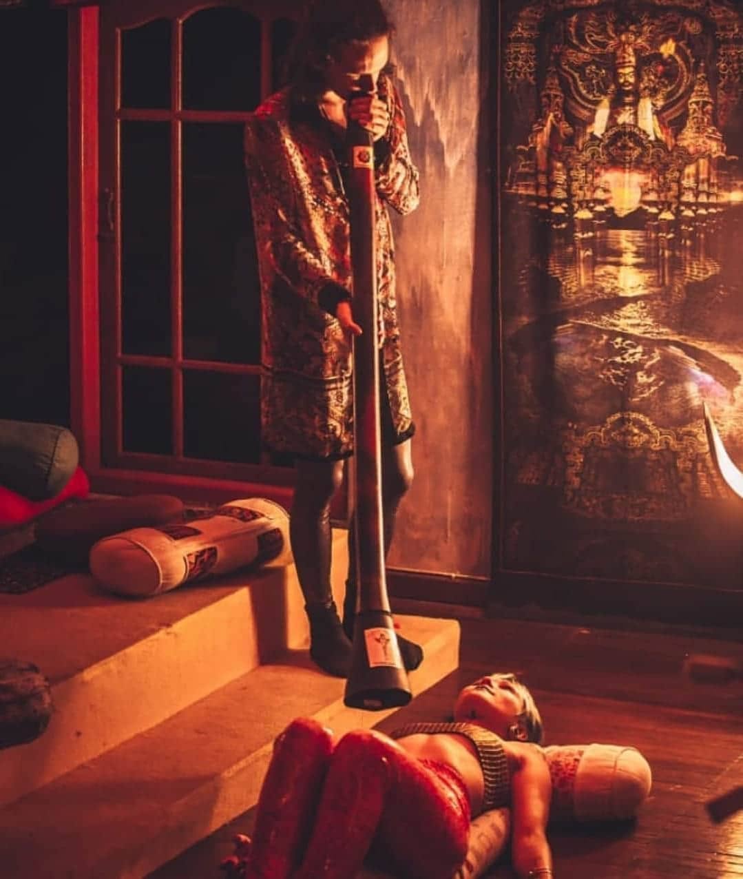 A private one to one didgeridoo session in warm candlelight